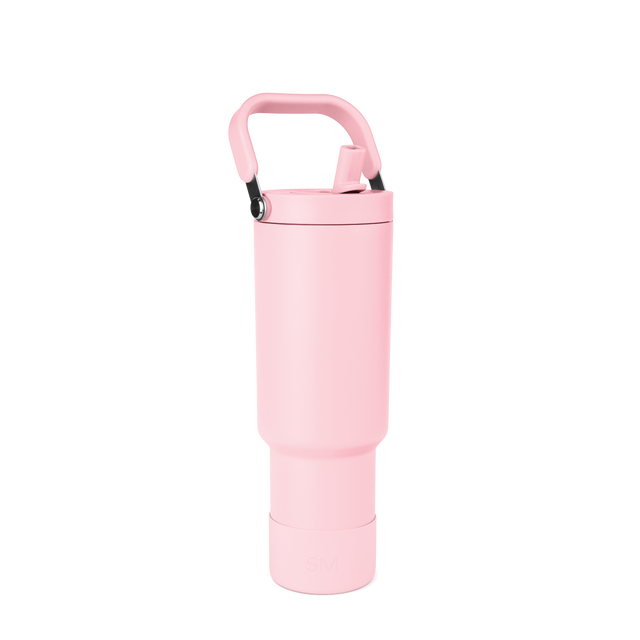 Tall cylindrical pale pink water bottle with rounded tapered design and wider middle section on white background Tall cylindrical pale pink water bottle with rounded tapered design and wider middle section on white background