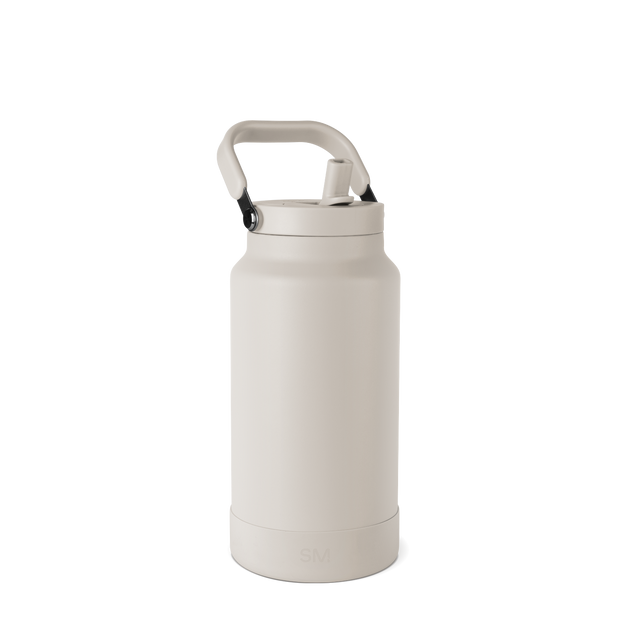 Cream-colored water bottle with aluminum accents on a pale gray-white background Cream-colored water bottle with aluminum accents on a pale gray-white background