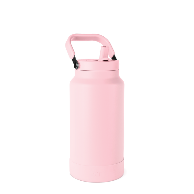 Soft pale pink water bottle with cap against white background Soft pale pink water bottle with cap against white background