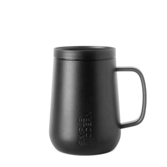 Matte black powder-coated mug with textured finish on neutral off-white background Matte black powder-coated mug with textured finish on neutral off-white background