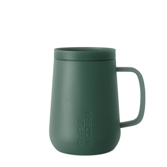 Sage green insulated mug with fitted lid and curved handle against white background Sage green insulated mug with fitted lid and curved handle against white background