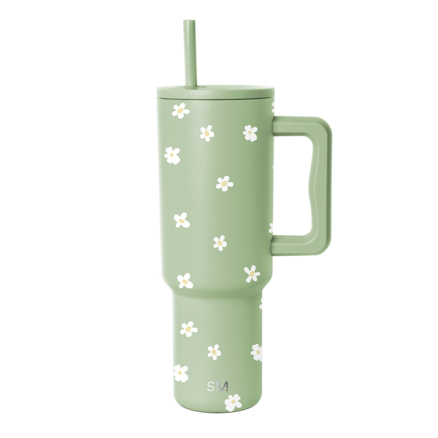 Soft sage green tumbler with white floral design accent Soft sage green tumbler with white floral design accent