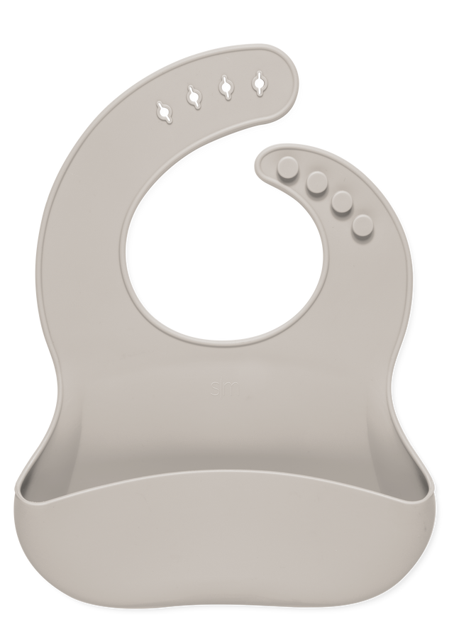 Soft beige bib with light taupe tone on white background Soft beige bib with light taupe tone on white background