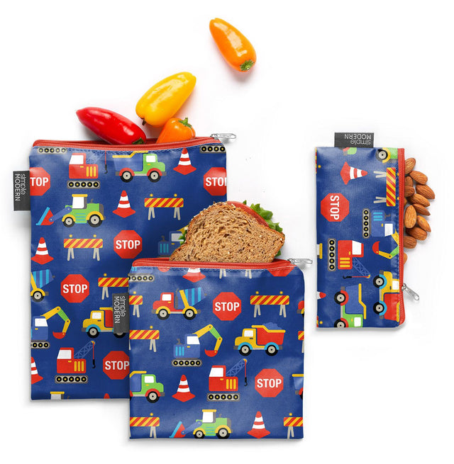 Navy blue reusable snack bags with construction theme design featuring bright red and primary colored accents on fabric pouches. Navy blue reusable snack bags with construction theme design featuring bright red and primary colored accents on fabric pouches.