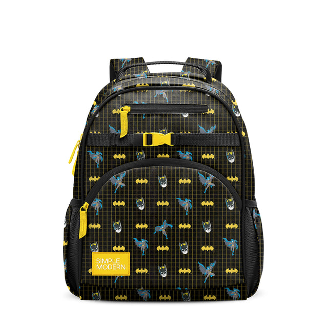 Black children's Batman backpack with yellow and blue accents, padded straps, multiple zippered pockets, mesh side pockets, and yellow carabiner clip on white background.