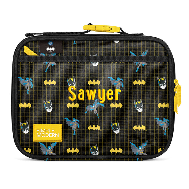 Black Batman insulated lunch case with bright yellow and electric blue design featuring Batman logo, cape, silhouette, and 