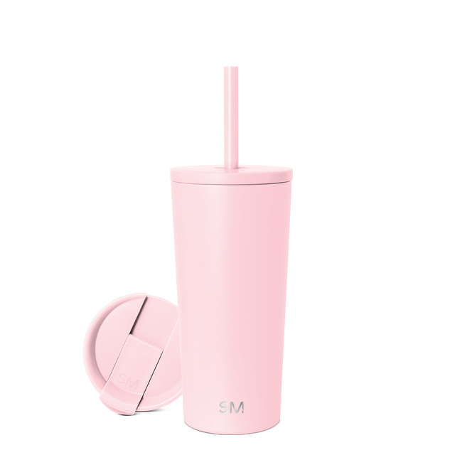 Pale pink cylindrical vessel with matching circular lid on neutral background