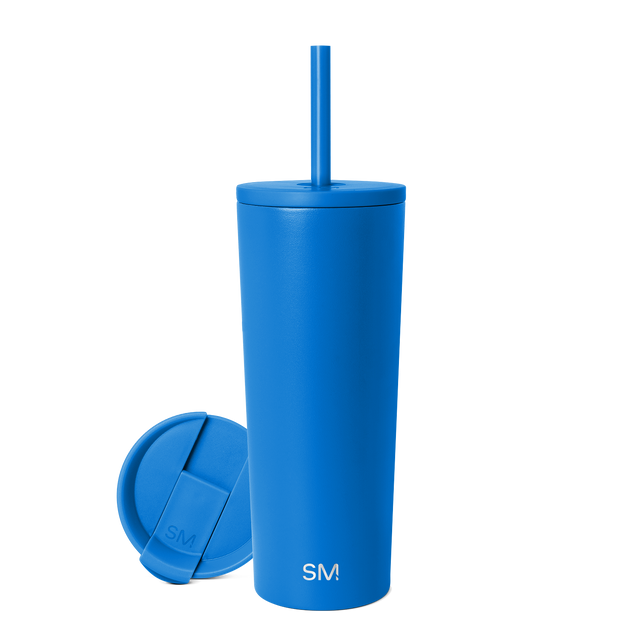 Bright royal blue insulated tumbler with matching lid on white background