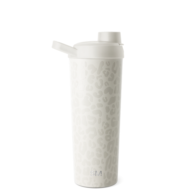White insulated tumbler with lid displayed against a neutral background