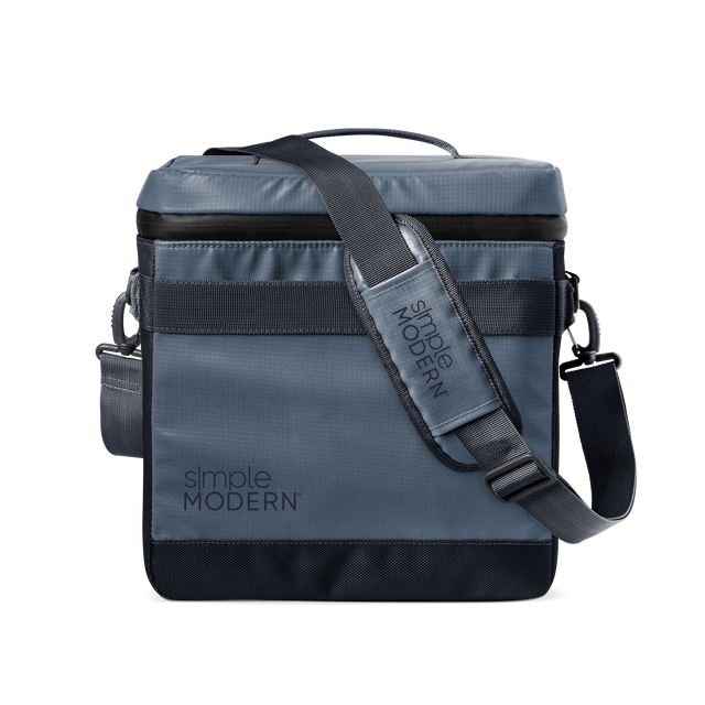 Slate blue-gray crossbody bag with black webbing strap and black accent details, modern neutral design