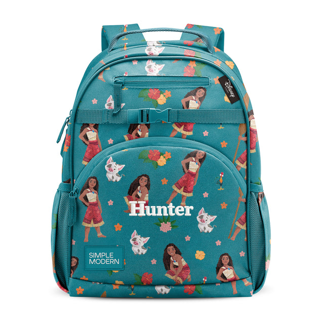Teal children's backpack with colorful allover print featuring an illustrated woman, fluffy white cat, flowers, and stars. Features padded straps, front zipper pocket, and side mesh pockets. Branded 