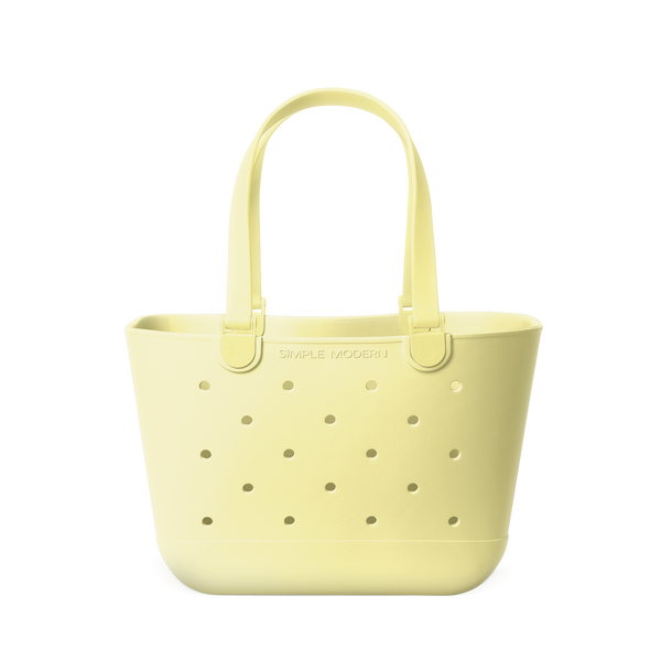 Soft butter yellow tote bag with sage green perforated dot detailing throughout