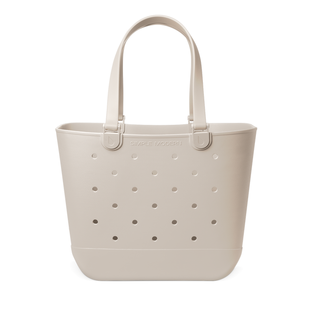 Soft beige cream-colored large tote bag on white background, minimalist design with neutral warm tone aesthetic