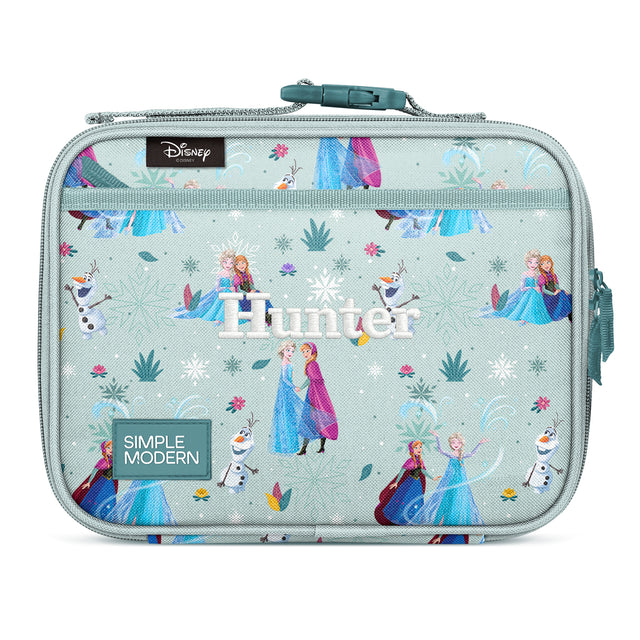 Simple Modern Frozen lunch box in mint green with Elsa, Anna, and Olaf characters, snowflakes, and ice palace design. Features teal handle, zippered top, and 