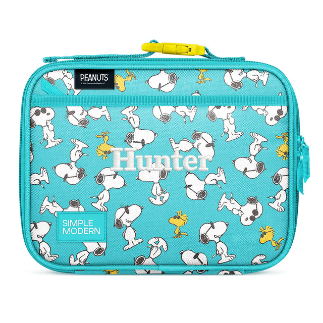 Turquoise Simple Modern lunch box with Snoopy and Woodstock characters from Peanuts printed throughout, featuring a yellow zipper, carrying handle, and side pockets on white background.