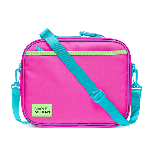 Hot pink insulated lunch bag with turquoise blue zippers, side handles, and adjustable shoulder strap for carrying meals and beverages