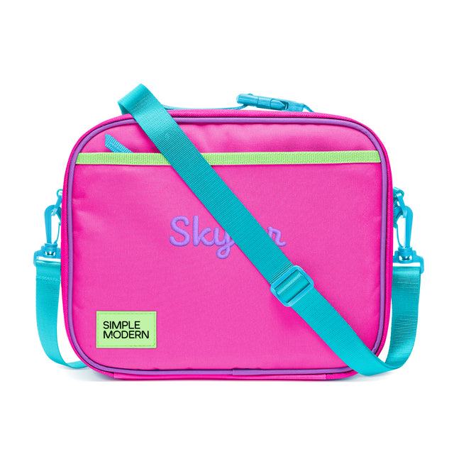 Hot pink insulated lunch bag with turquoise zipper, handles, and straps. Features lime green stripe detail, purple 
