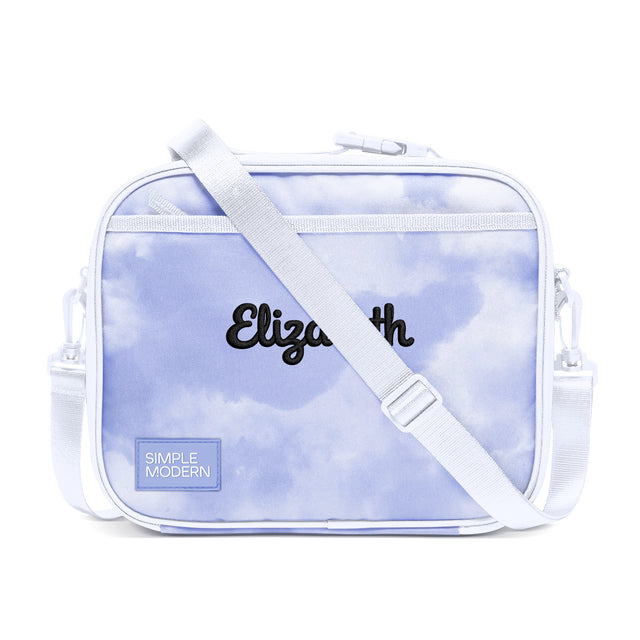 Periwinkle and white personalized lunch bag with cloud print pattern, white shoulder strap, side handles, and 