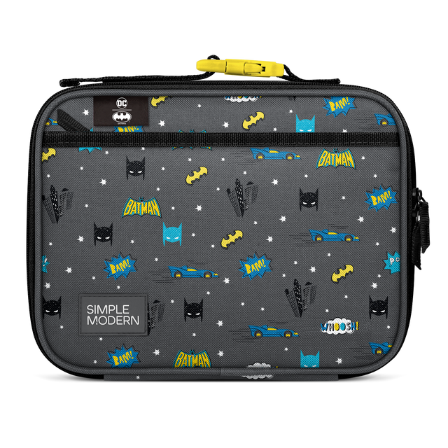 Dark charcoal gray lunch container with bright yellow, electric blue, and white accent design details