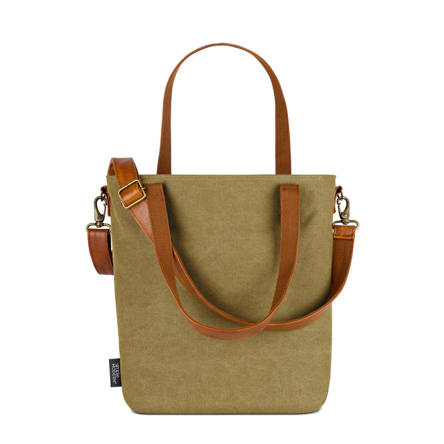 Sage green canvas tote bag with cognac brown leather handles and side accents