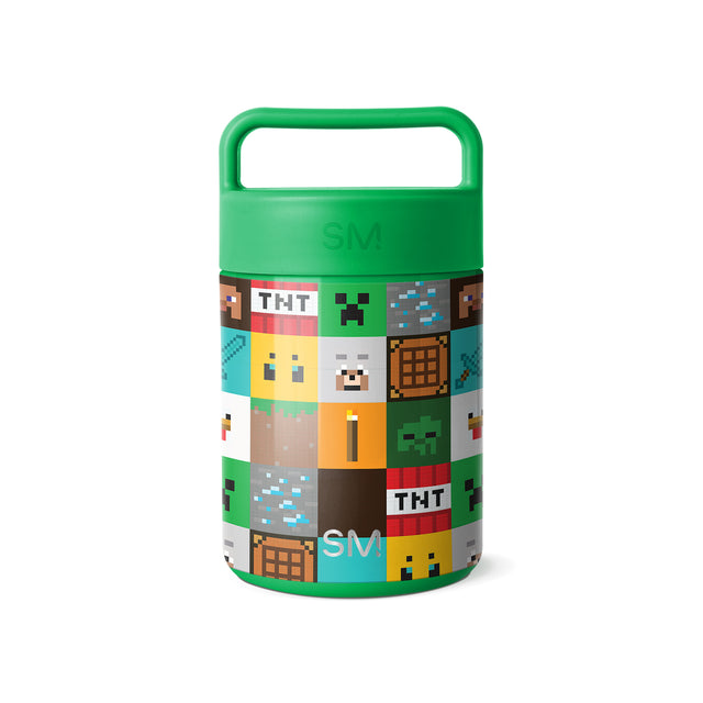 Minecraft-themed cylindrical food container with kelly green lid and carry handle, featuring pixelated collage of game elements including TNT blocks, creepers, and pixel characters on the body.