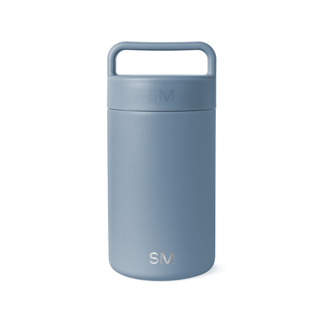 Dusty blue-gray ceramic jar with cylindrical shape and neutral muted tone on white background