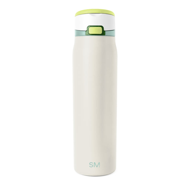 Cream-colored insulated tumbler with lime green rim and base against white background