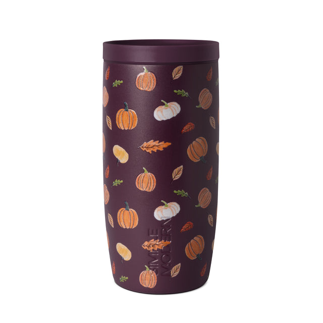 Dark plum cylindrical insulated tumbler with autumn-themed print featuring scattered warm-colored illustrations on white background