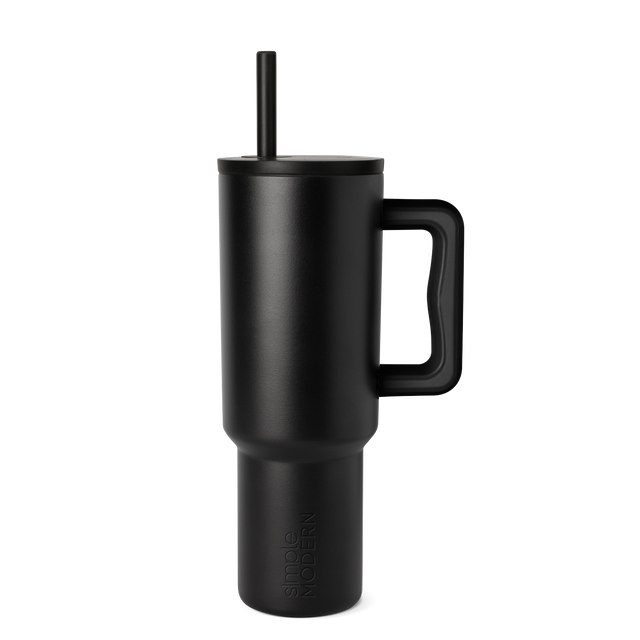 Matte black tumbler with gray tonal variations on white background