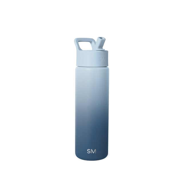 Simple Modern insulated water bottle with ombre gradient from light blue-gray to navy blue, featuring angular carry handle, flip spout, and SM logo emblem.