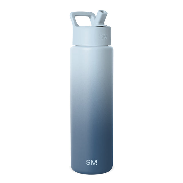 Powder blue to slate blue gradient insulated water bottle with integrated carry handle and flip-top spout. SM logo on cap and lower body. Studio product photo on white background.