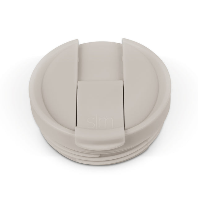 Beige and cream colored flip-top lid with matching components in light taupe, shown in monochromatic neutral tones