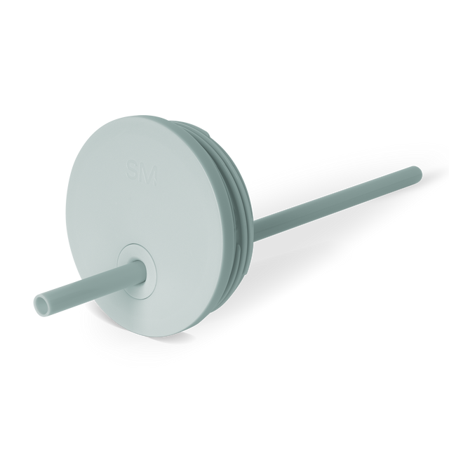 Soft sage green circular lid with cylindrical straw housing and neutral teal accents, suitable for beverages and daily use.