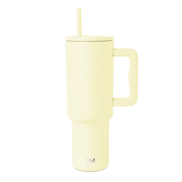 Pale butter yellow 40-ounce Simple Modern insulated tumbler with handle, flat lid, straw opening, and matching yellow straw on white background.