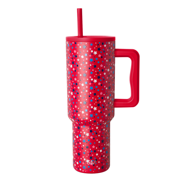 Red tumbler with scattered white geometric shapes and stars pattern