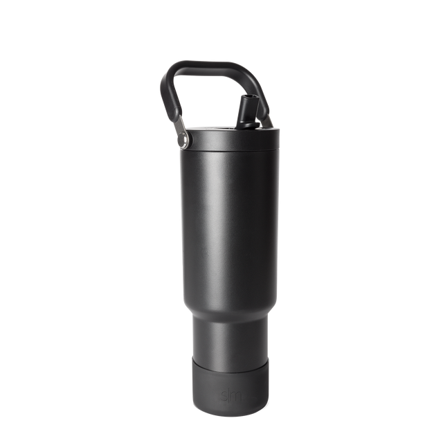 Black matte finish bottle with metallic gray accents, handle, and base against dark gray background