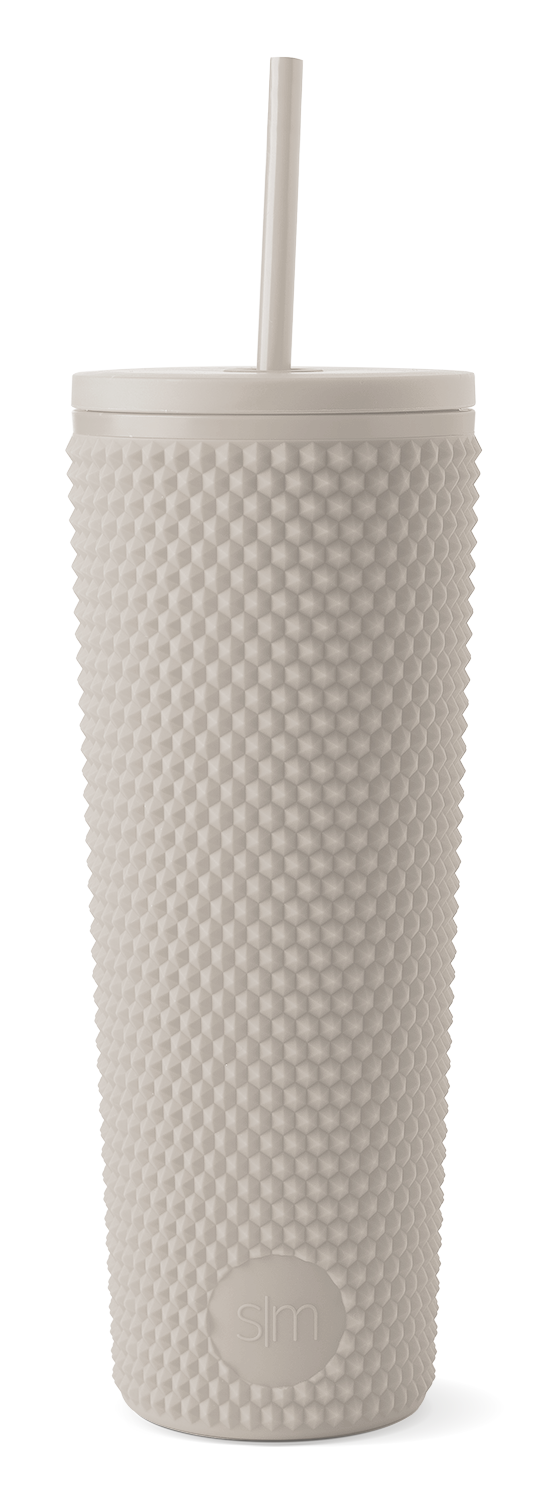 Cream-colored textured tumbler with modern design on white background