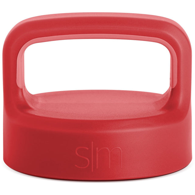 Coral-red product with handle, viewed from above showing consistent saturated color with subtle tonal variations across the exterior surface.