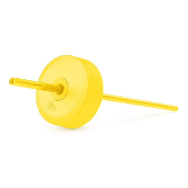 Bright yellow reusable straw and disc on matching yellow background, showing varying shades from pale to vibrant yellow tones